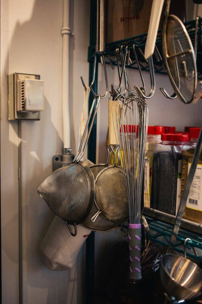 kitchen utensils hanging on hook